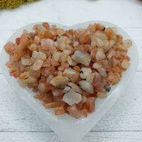 five ounces of sunstone crystal chips in abalone shell