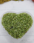 five ounces of peridot stone chips in selenite bowl