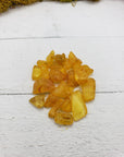 6 grams of amber stone chips on display