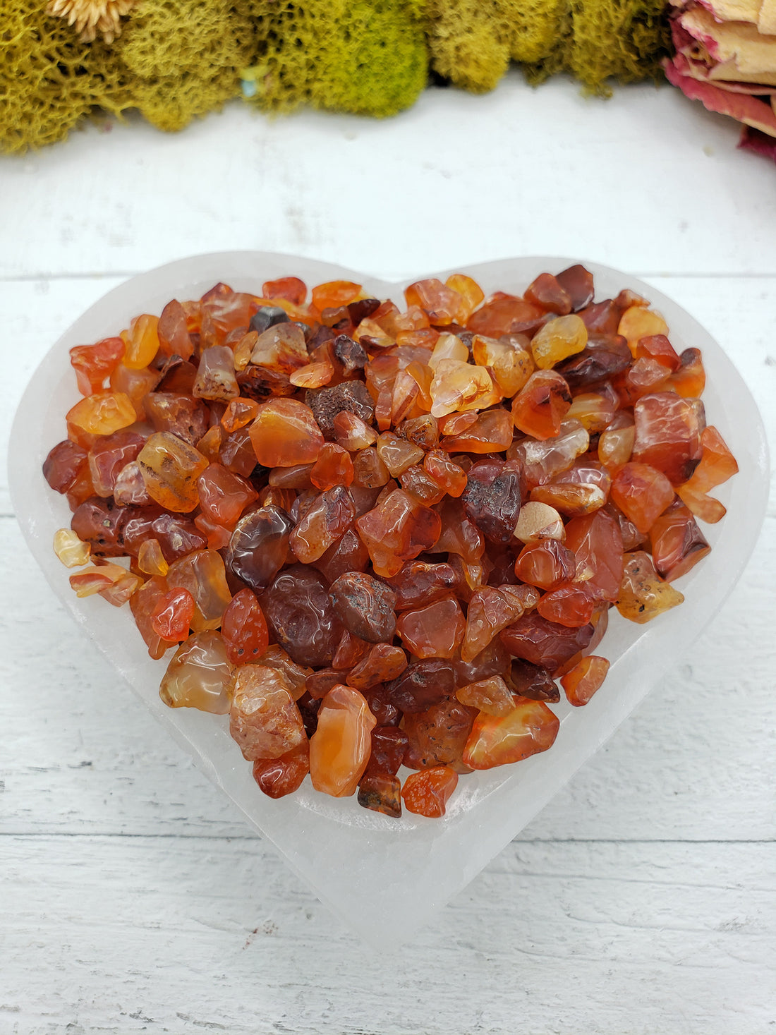 six ounces of carnelian stone chips in selenite bowl