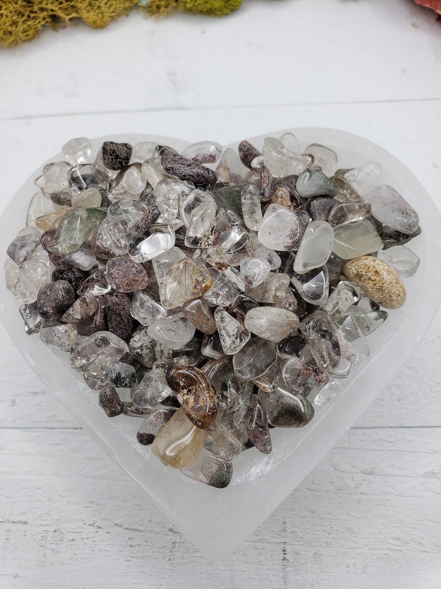 Six ounces of green phantom quartz chips in selenite bowl