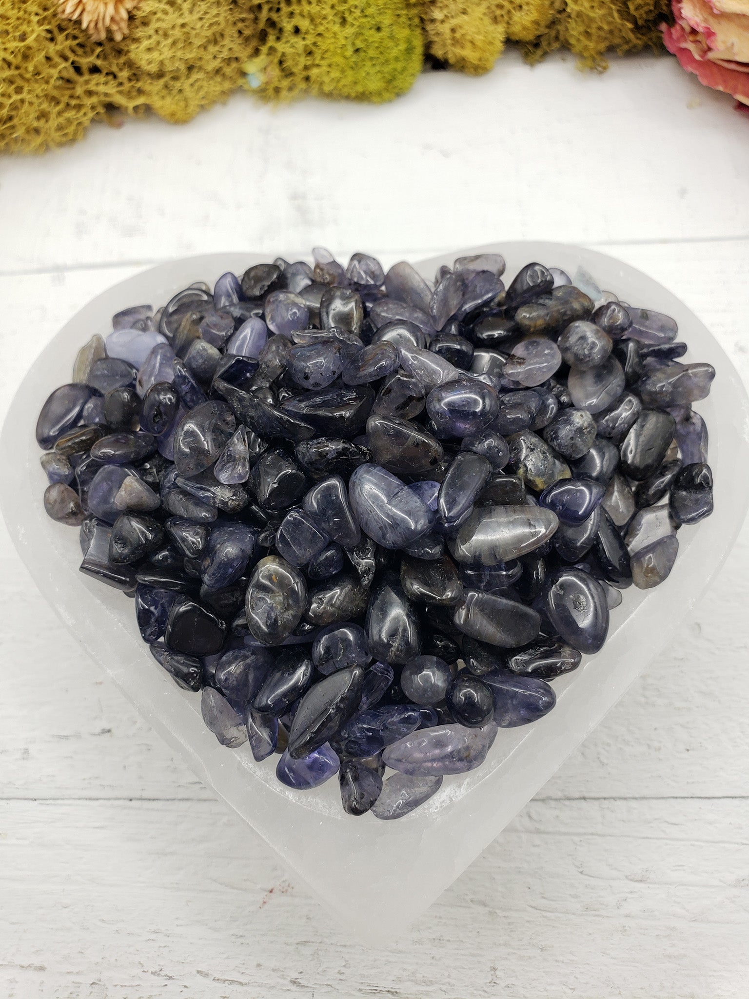 Six ounces of iolite crystal chips in selenite bowl