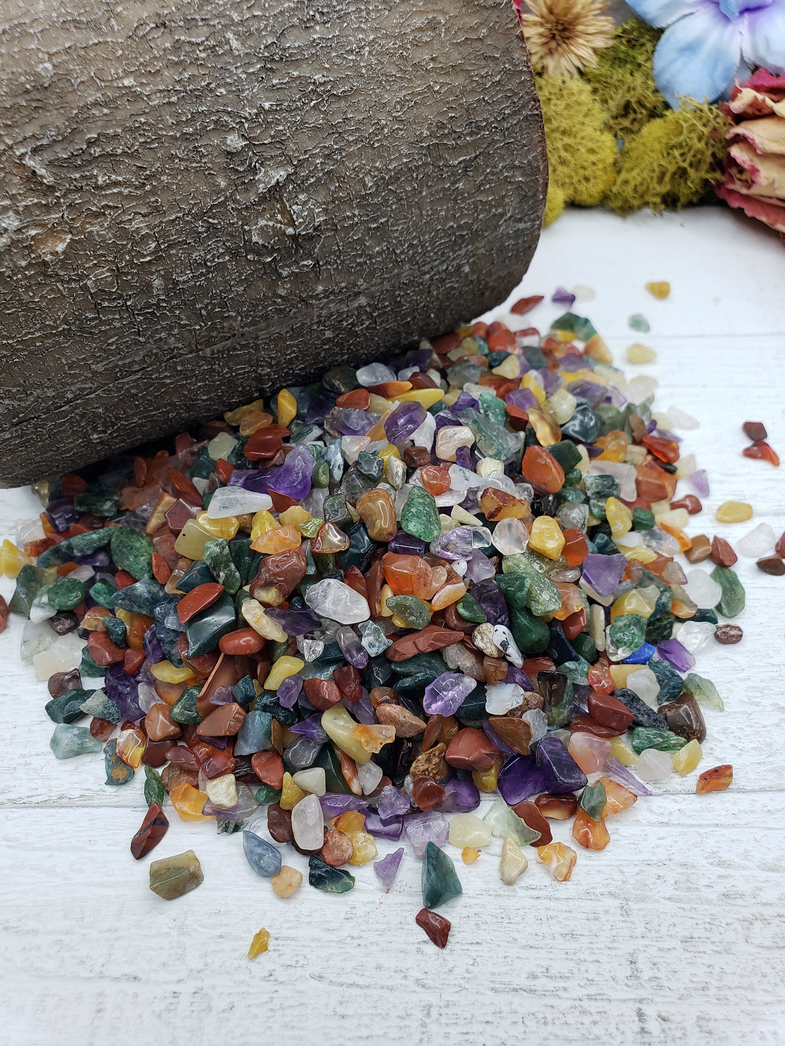 Six ounces of mixed gemstone crystal chips on display