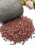prop crystal display with six ounces of red jasper stone chips