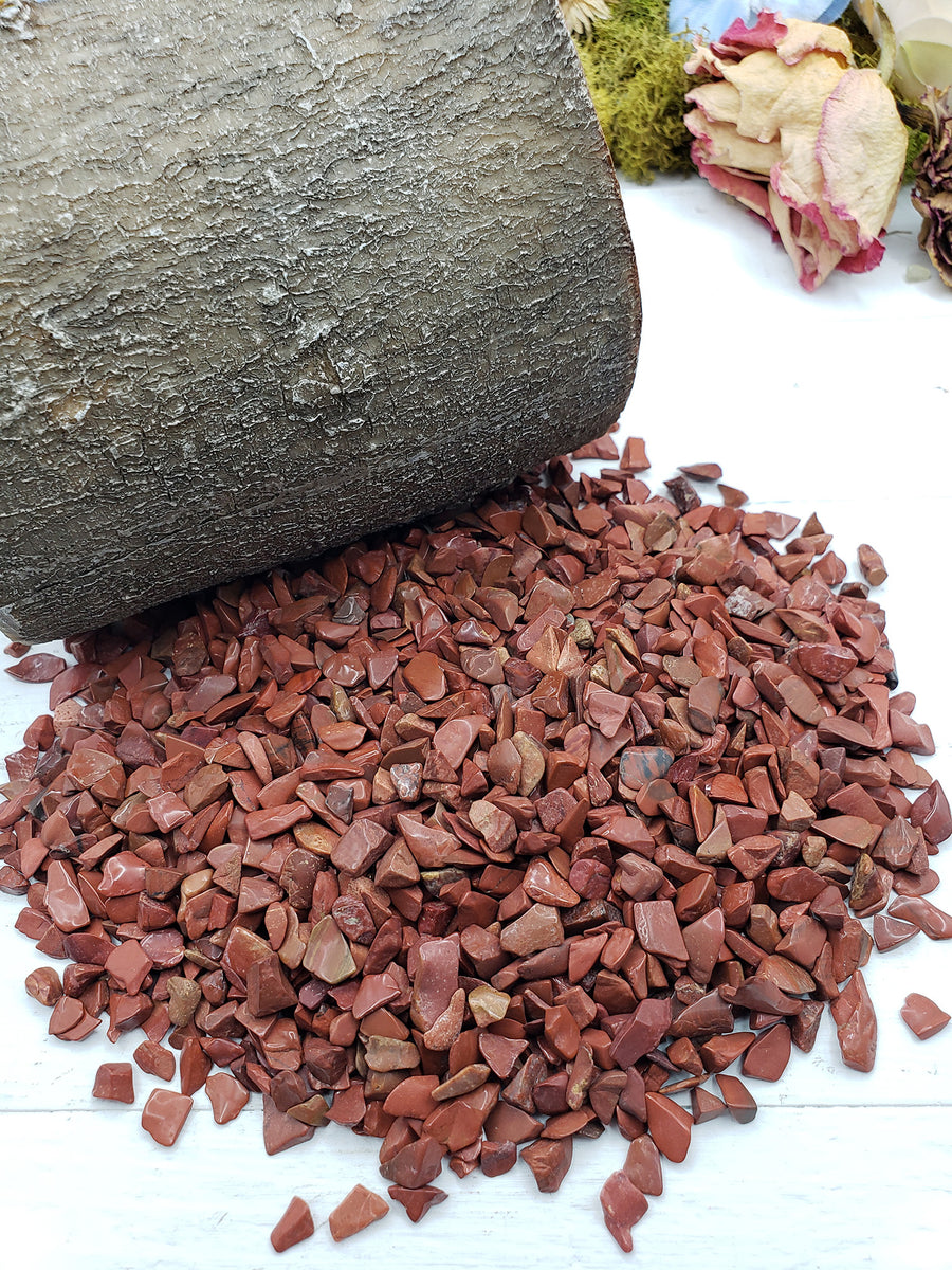 prop crystal display with six ounces of red jasper stone chips
