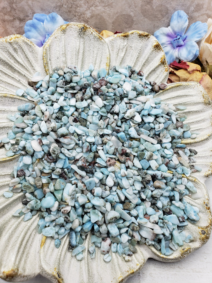 Seven ounces of larimar crystal chips on floral display prop dish