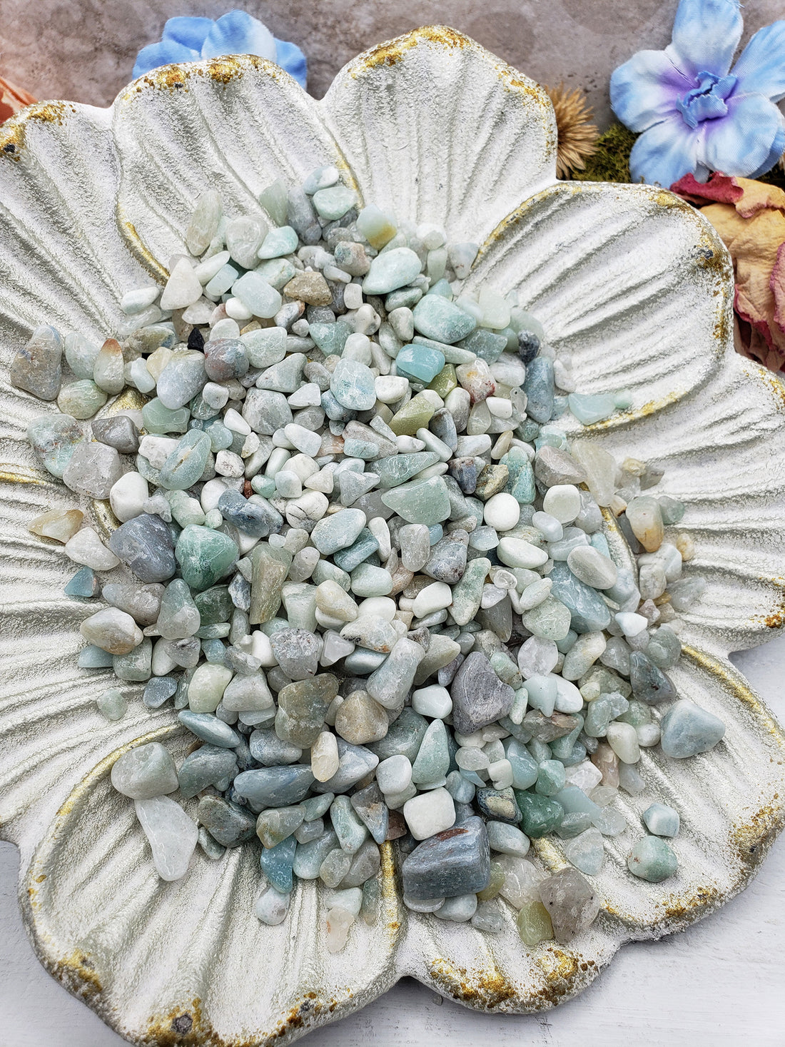seven ounces of amazonite crystal chips on floral dish