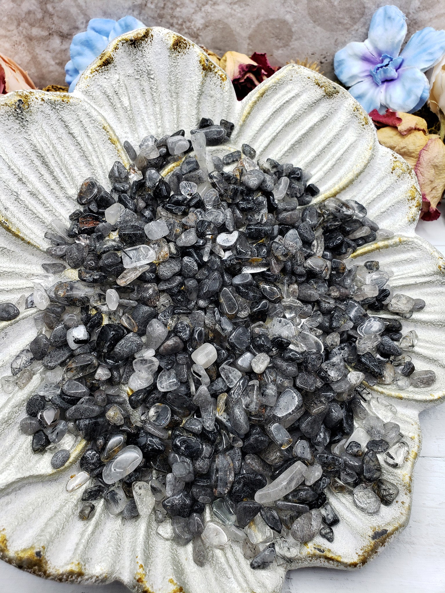 seven ounces of black tourmaline rutilated quartz on floral display dish