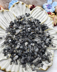 seven ounces of black tourmaline rutilated quartz on floral display dish