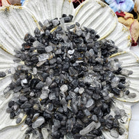 seven ounces of black tourmaline rutilated quartz on floral display dish