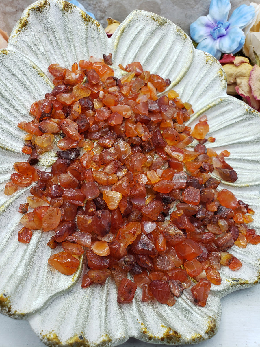 seven ounces of carnelian stone chips on floral dish display