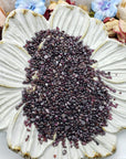 seven ounces of garnet crystal chips on floral dish display 