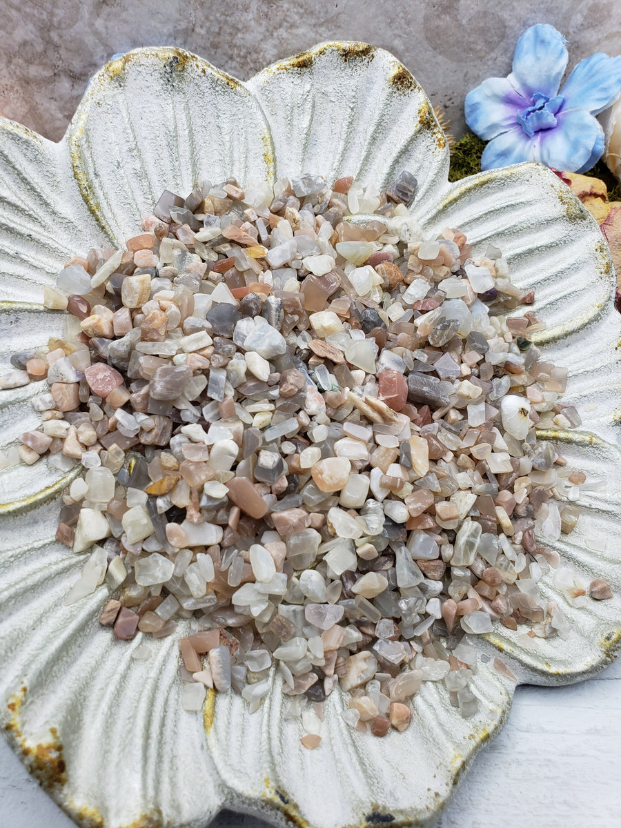 Seven ounces of moonstone chips on floral dish display
