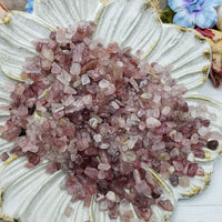 seven ounces of strawberry quartz chips on floral dish display