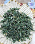 Seven ounces of green aventurine chips on floral prop display