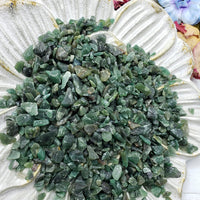 Seven ounces of green aventurine chips on floral prop display