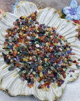Seven ounces of mixed gemstone crystal chips on floral dish display
