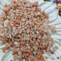 seven ounces of sunstone chips on floral dish 