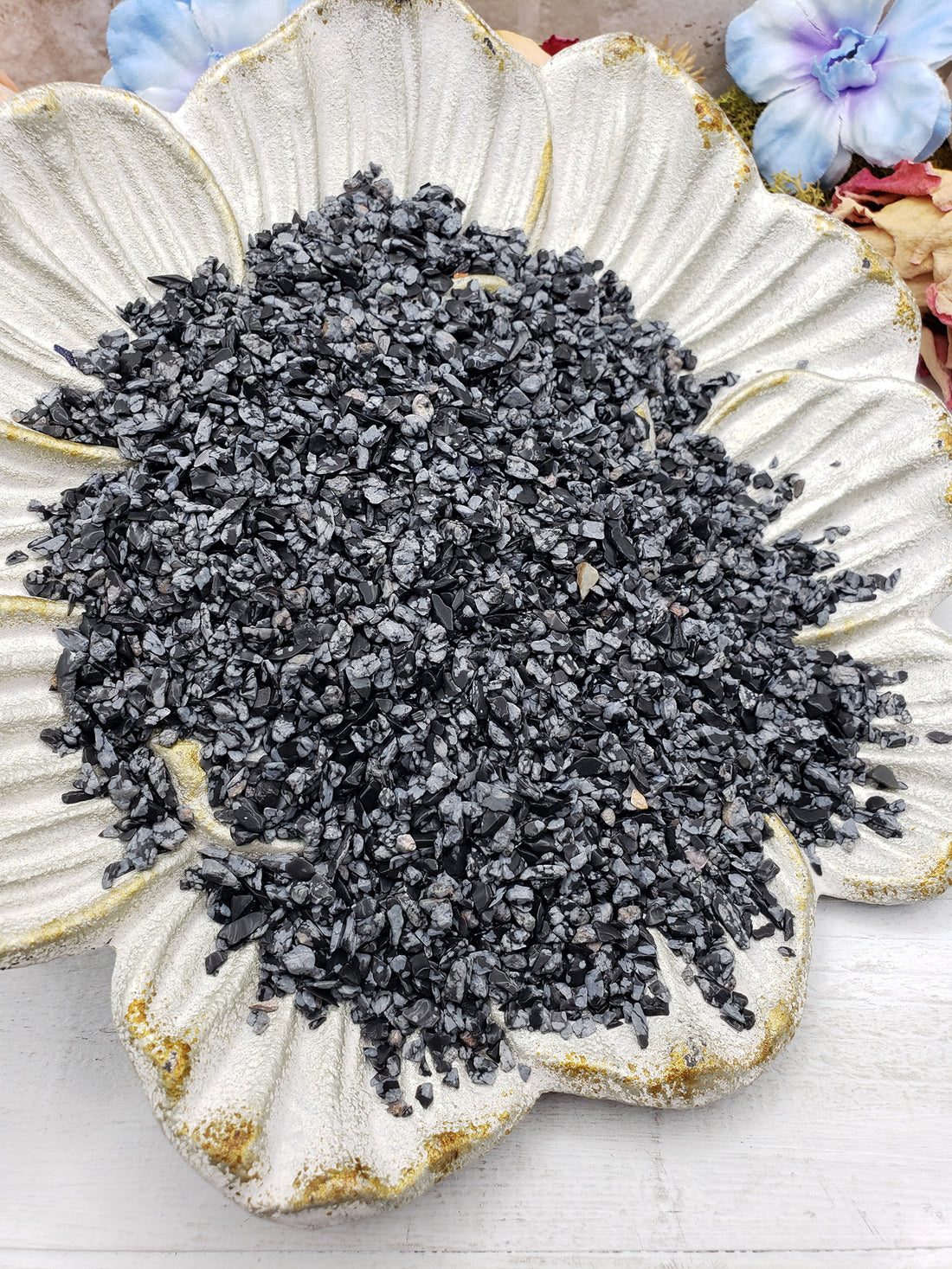 Seven ounces of snowflake obsidian on floral dish display