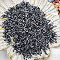 Seven ounces of snowflake obsidian on floral dish display