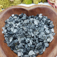 eight ounces of black tourmaline rutilated quartz in wooden bowl