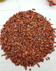 eight ounces of red jasper stone chips on crystal display