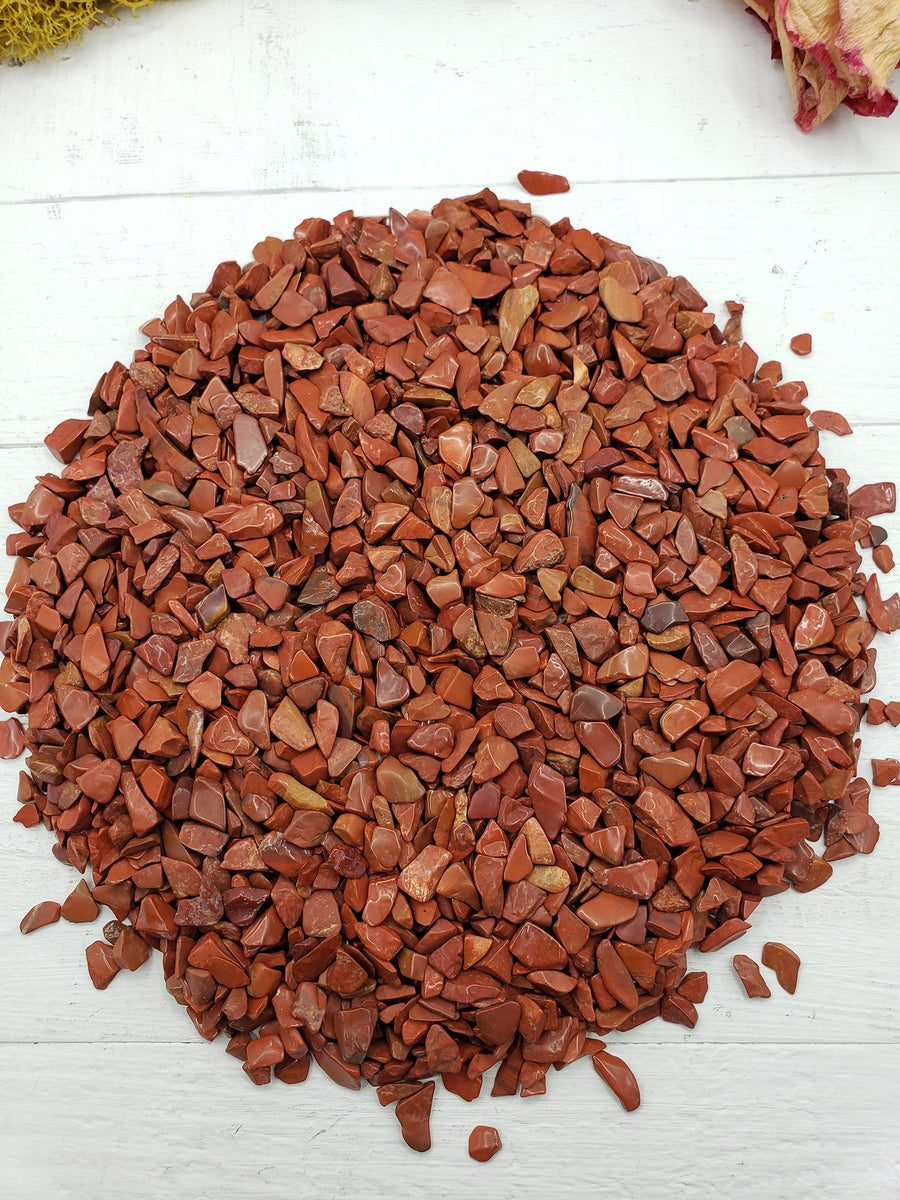 eight ounces of red jasper stone chips on crystal display