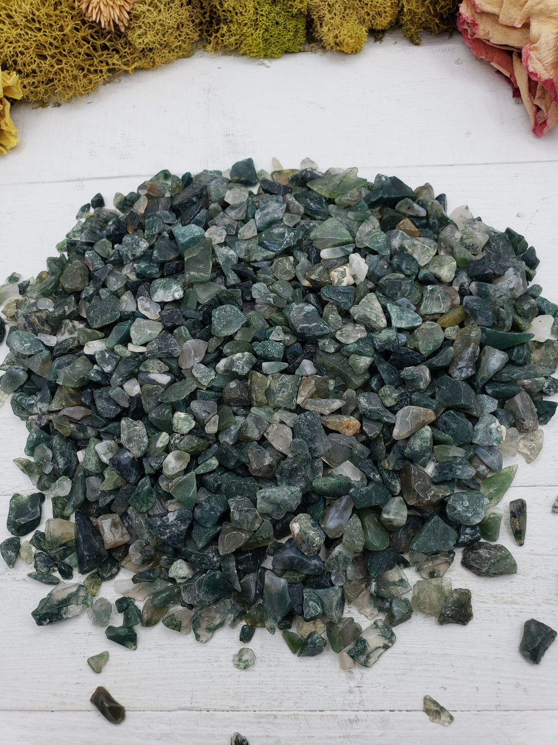 Eight ounces of green moss agate chips on display