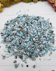Eight ounces of larimar stone chips on display
