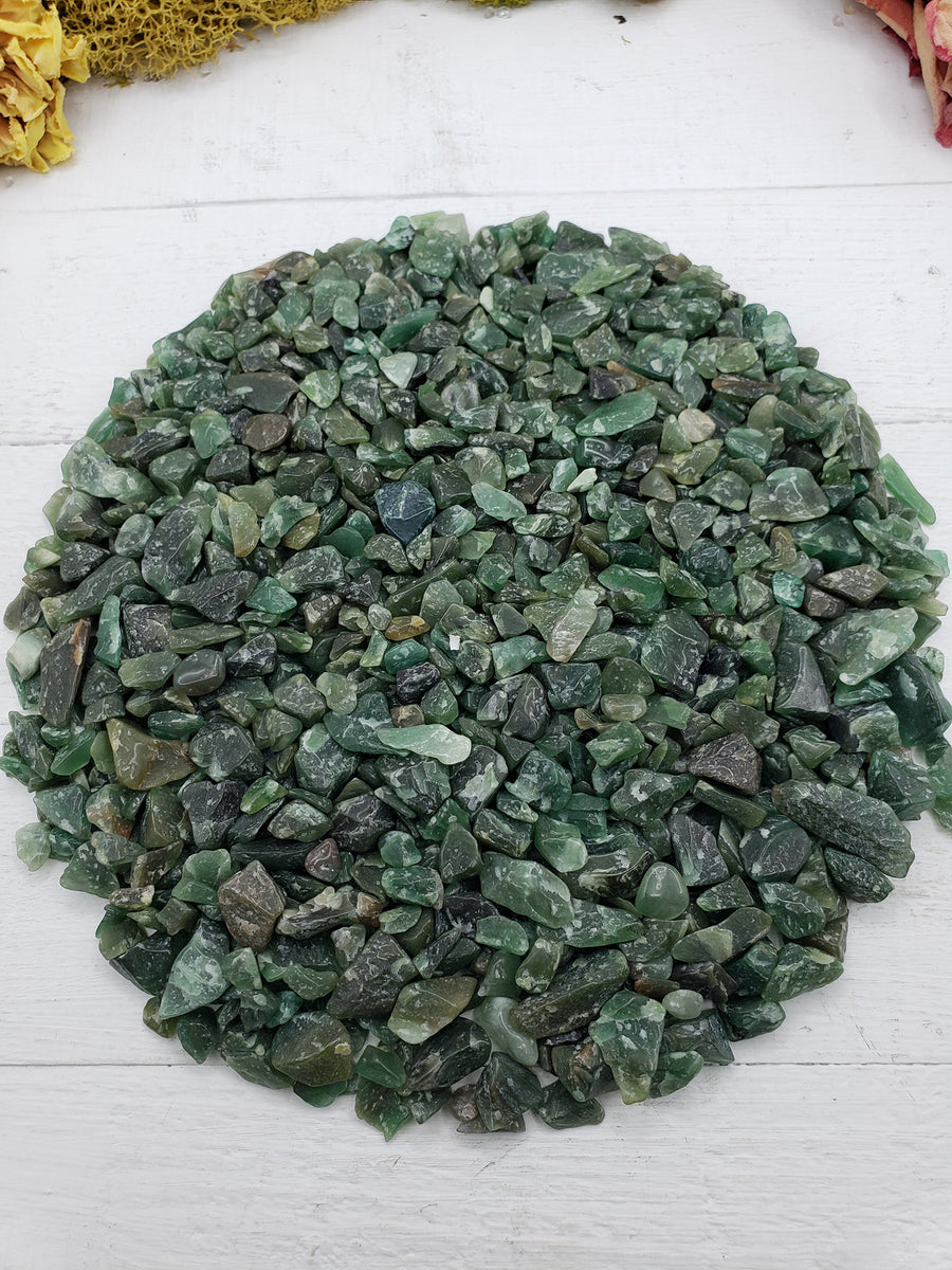 Eight ounces of green aventurine chips on crystal display