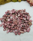 Eight ounces of rhodonite chips on display