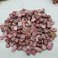 Eight ounces of rhodonite chips on display