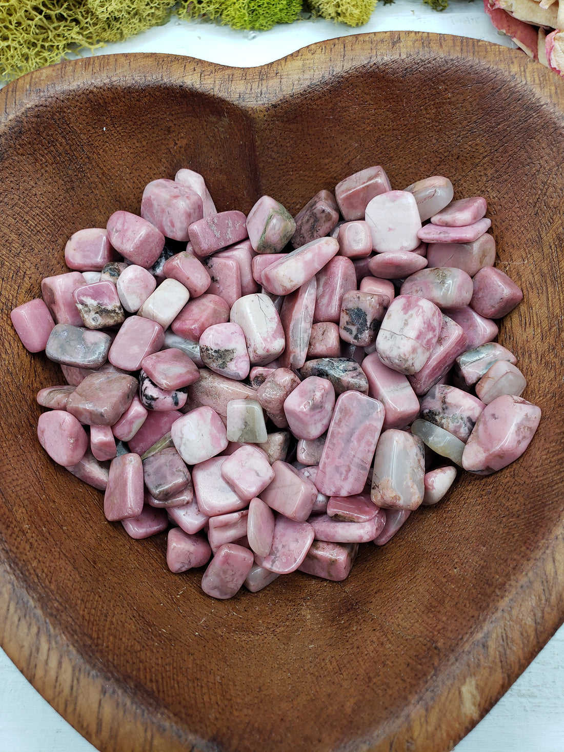 Eight ounces of rhodonite crystal chips in bowl