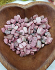 Eight ounces of rhodonite crystal chips in bowl