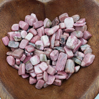 Eight ounces of rhodonite crystal chips in bowl