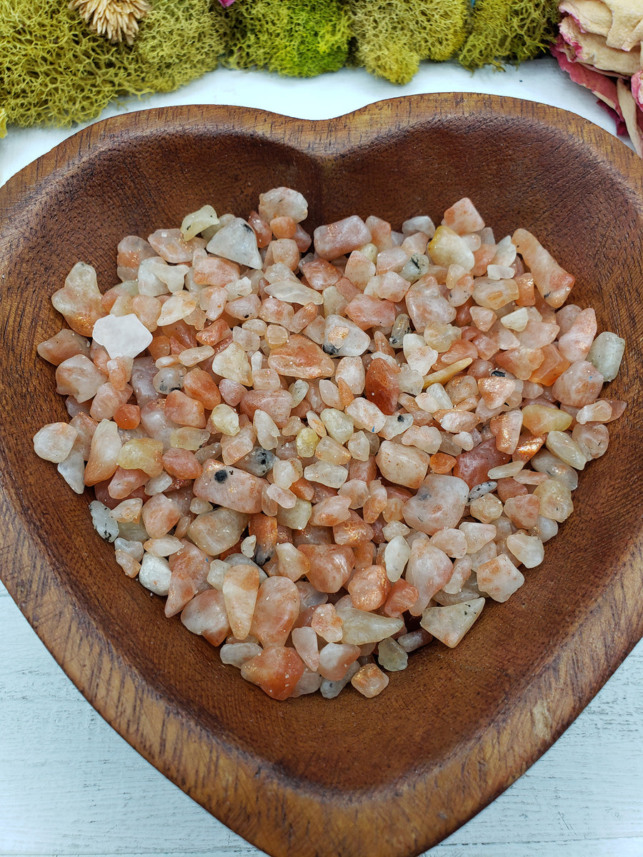 eight ounces of sunstone chips in wooden bowl