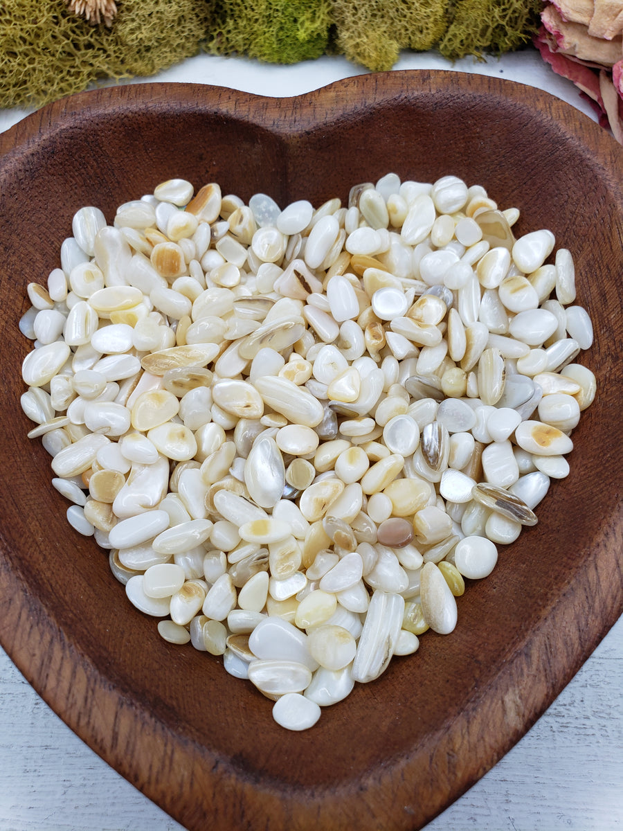 8 ounces of mother of pearl chips in wooden bowl