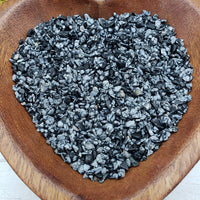 Eight ounces of snowflake obsidian crystal in wooden bowl 