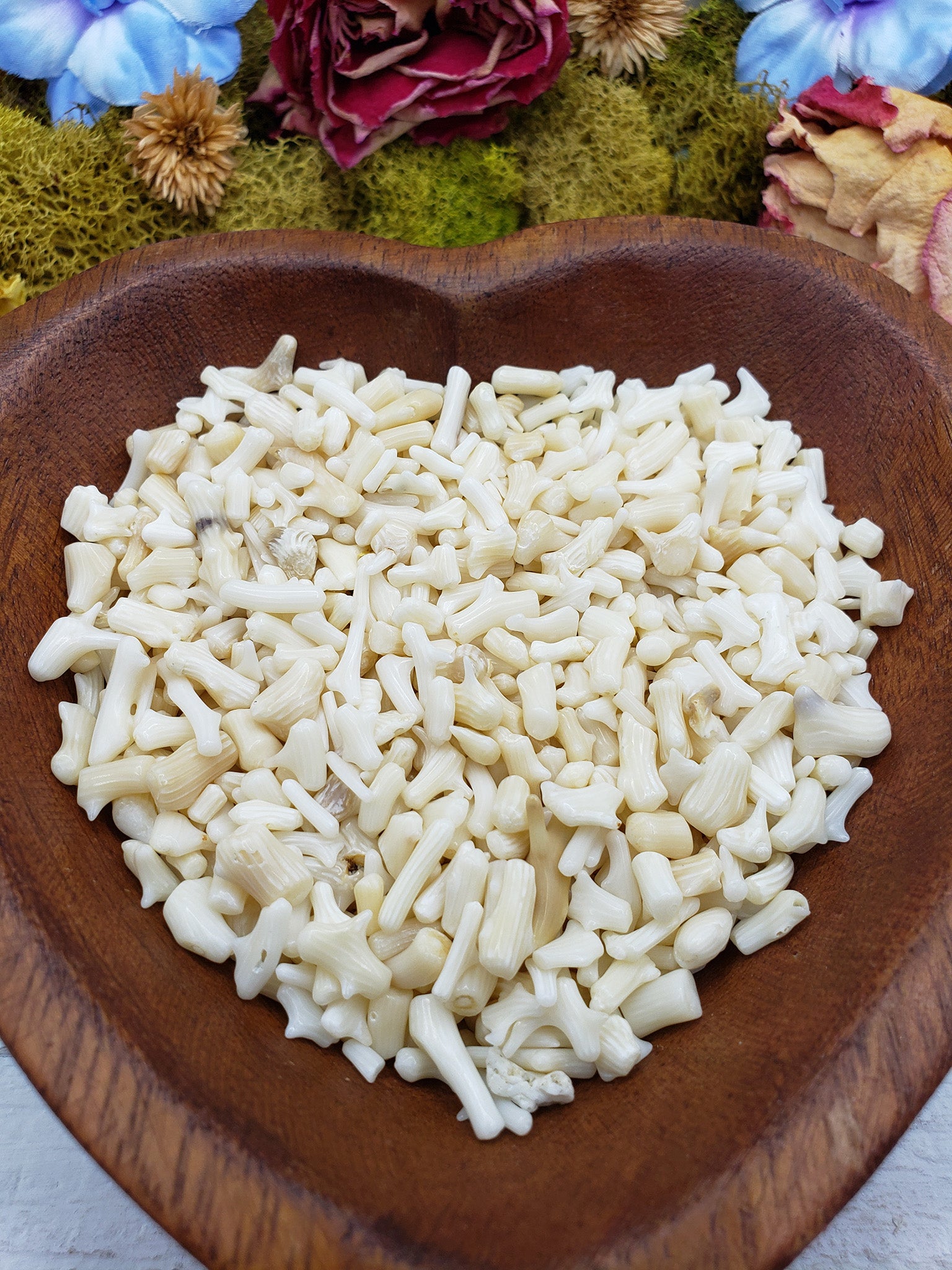 eight ounces of bamboo coral chips in wooden bowl