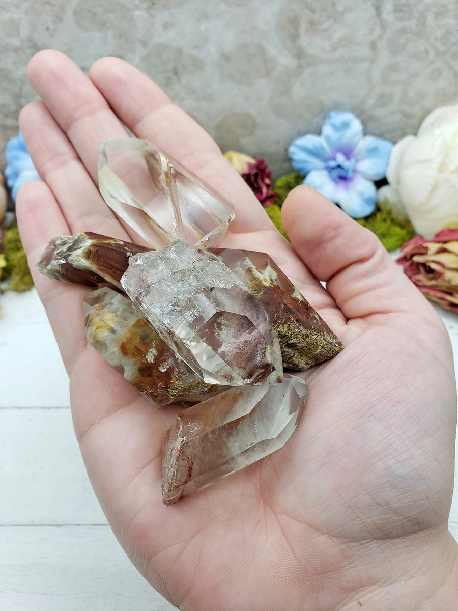 angel phantom quartz crystals in hand
