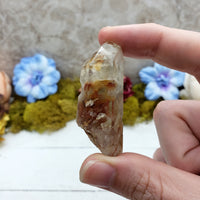hand pinching angel phantom quartz 