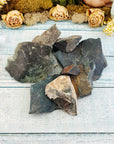 Several large rough bloodstone crystal pieces on display