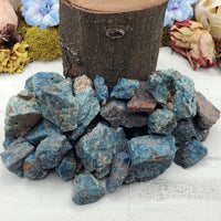 Collection of rough blue apatite stones by prop log