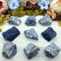 nine rough blue quartz stones on display