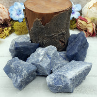 log prop surrounded by rough blue quartz stones