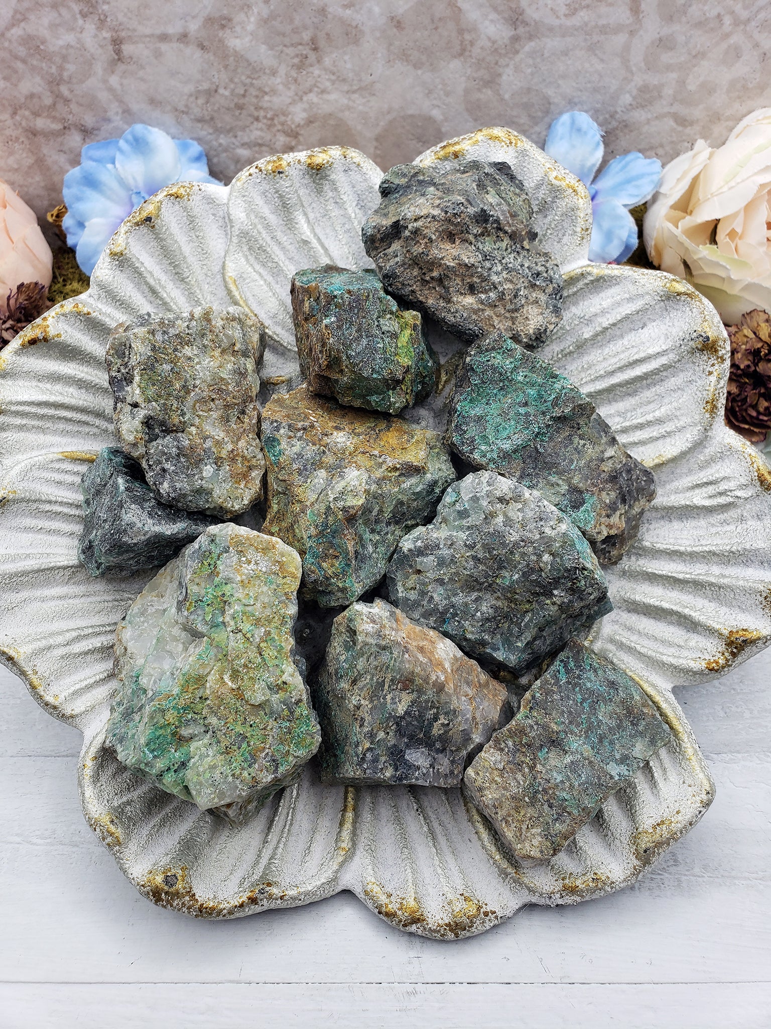 floral dish with several rough chrysoprase stones