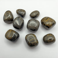 Camouflage jasper crystal pieces on white background