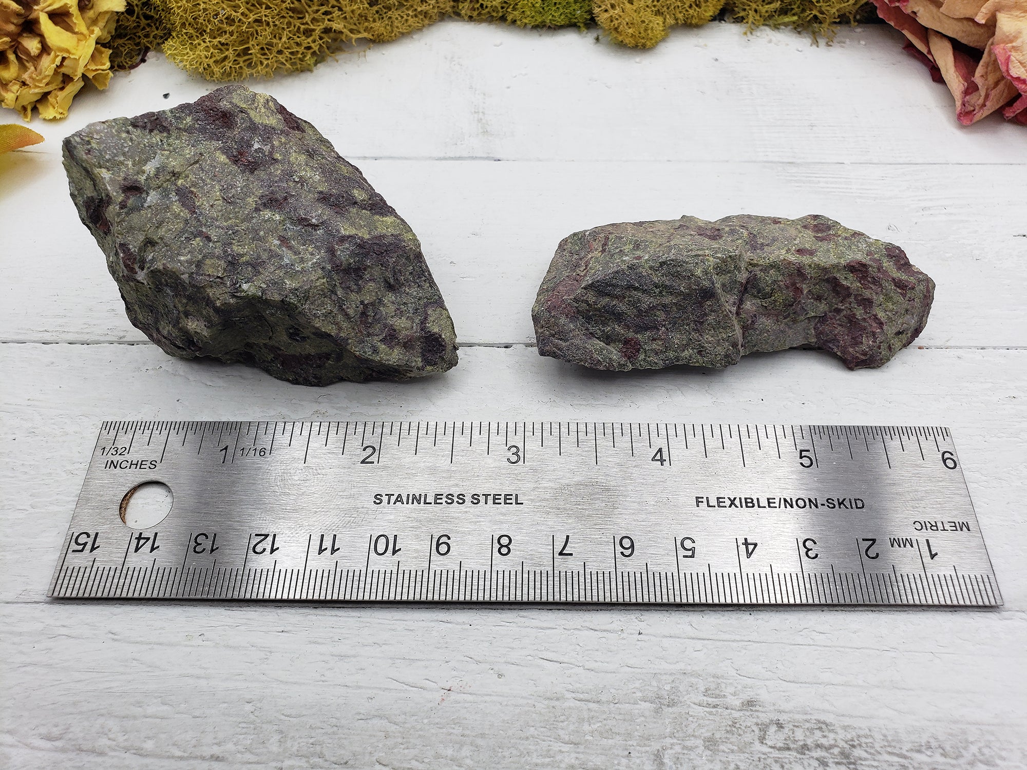 two dragon stone pieces by ruler for comparison
