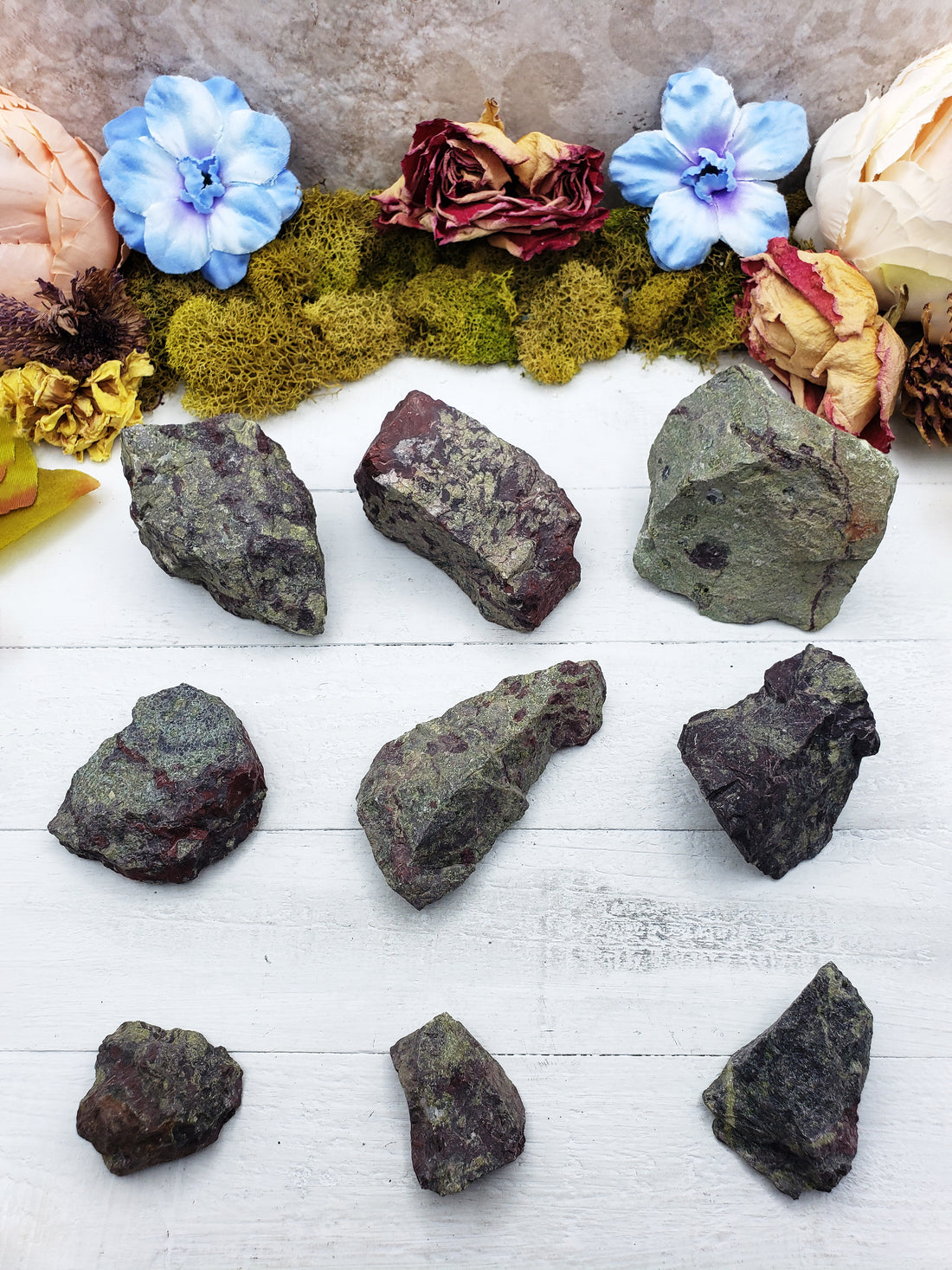 nine rough dragon stone pieces on display