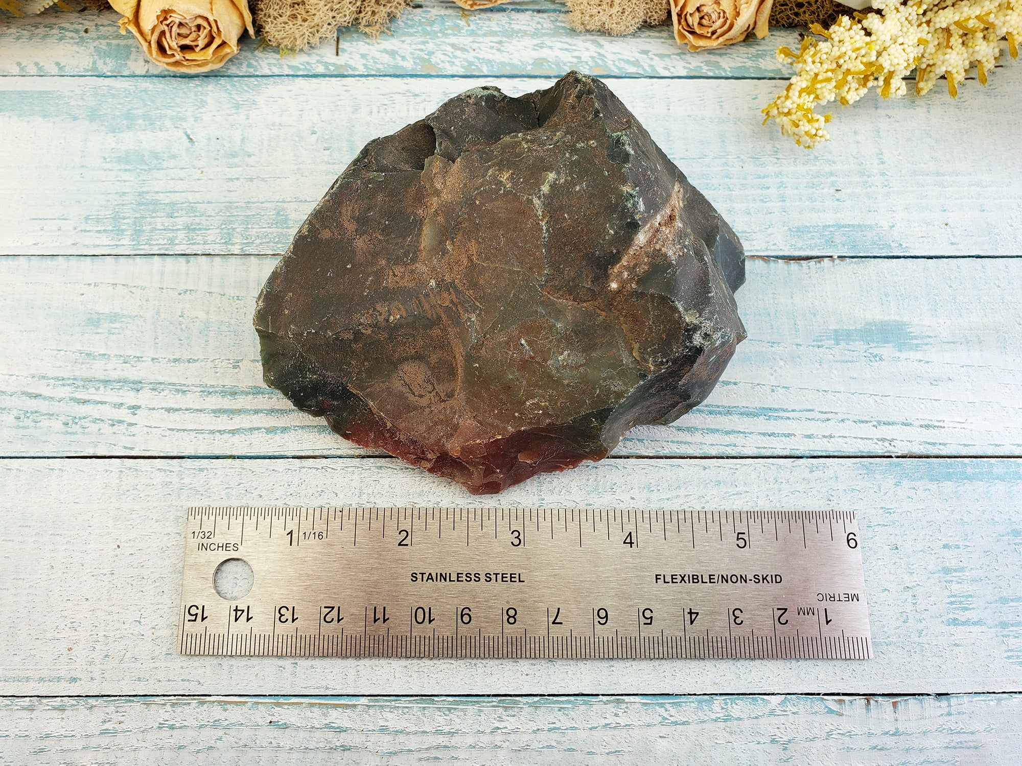 large rough fancy jasper by ruling, giving an estimate of its size